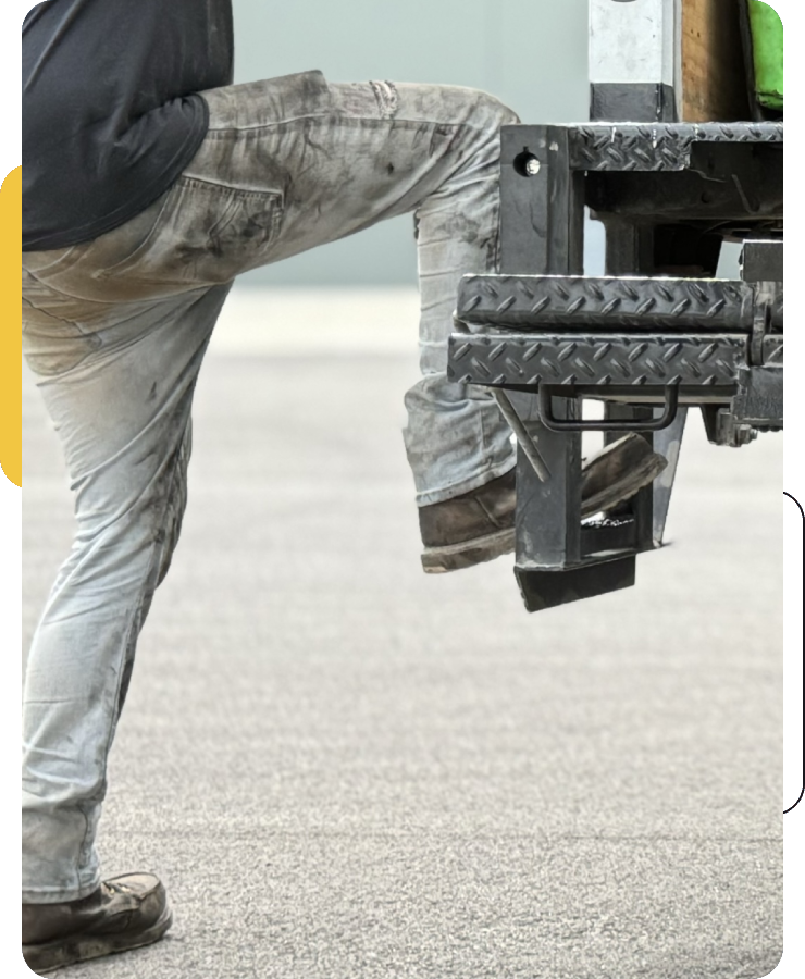 A person standing on the ground with their feet up.